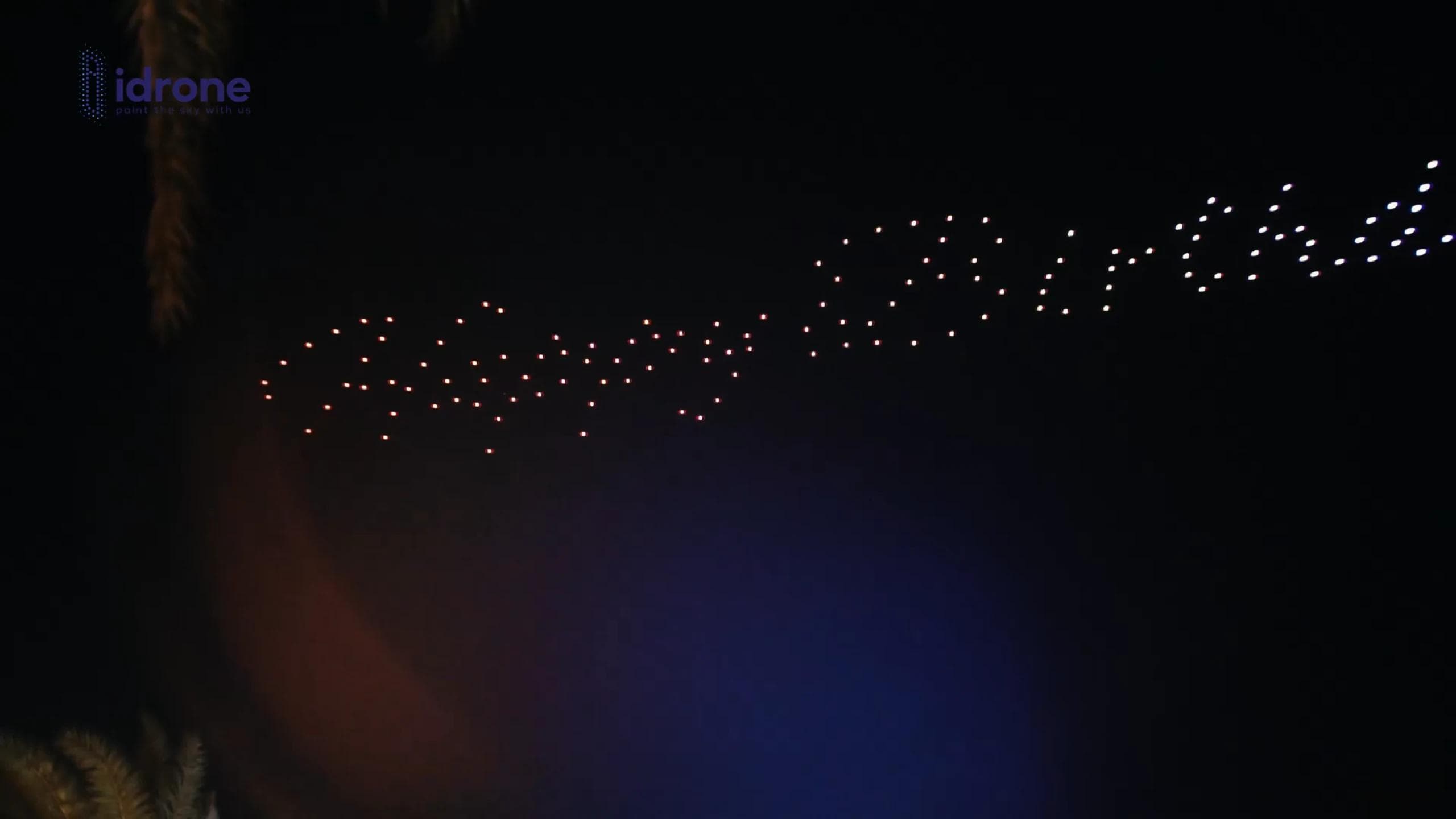 Abstract opening wave in warm and white lights above Susan Birthday at Dreamville Beach Club PIK 2